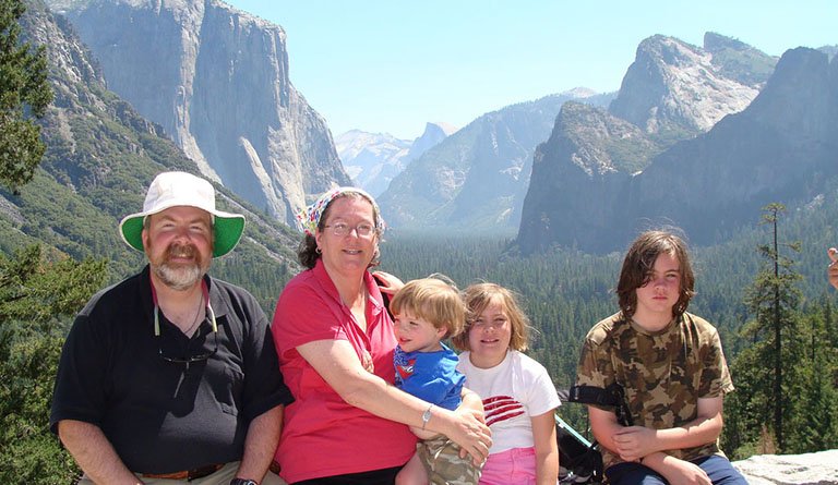 Family Standing In Front Of Canyon