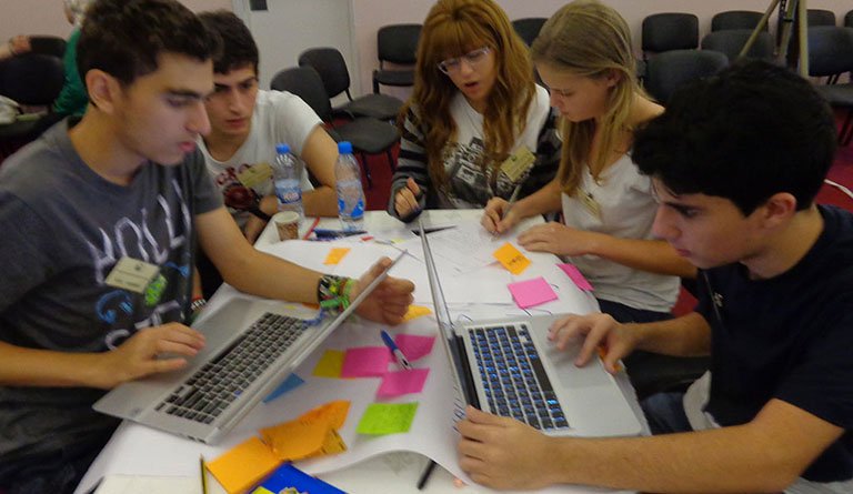 Students Sitting On Laptops