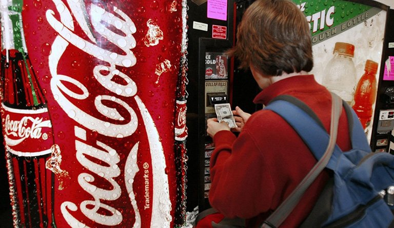 Student Using Vending Machine In School